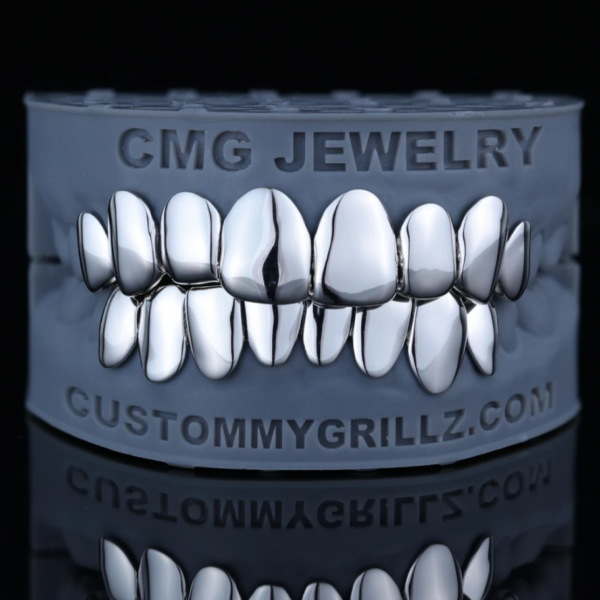 High-polish solid silver full-set grillz displayed on a dental model.