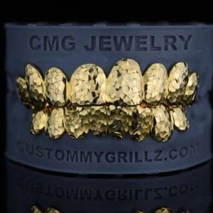 Gold-tone grillz with a faceted crushed ice finish.