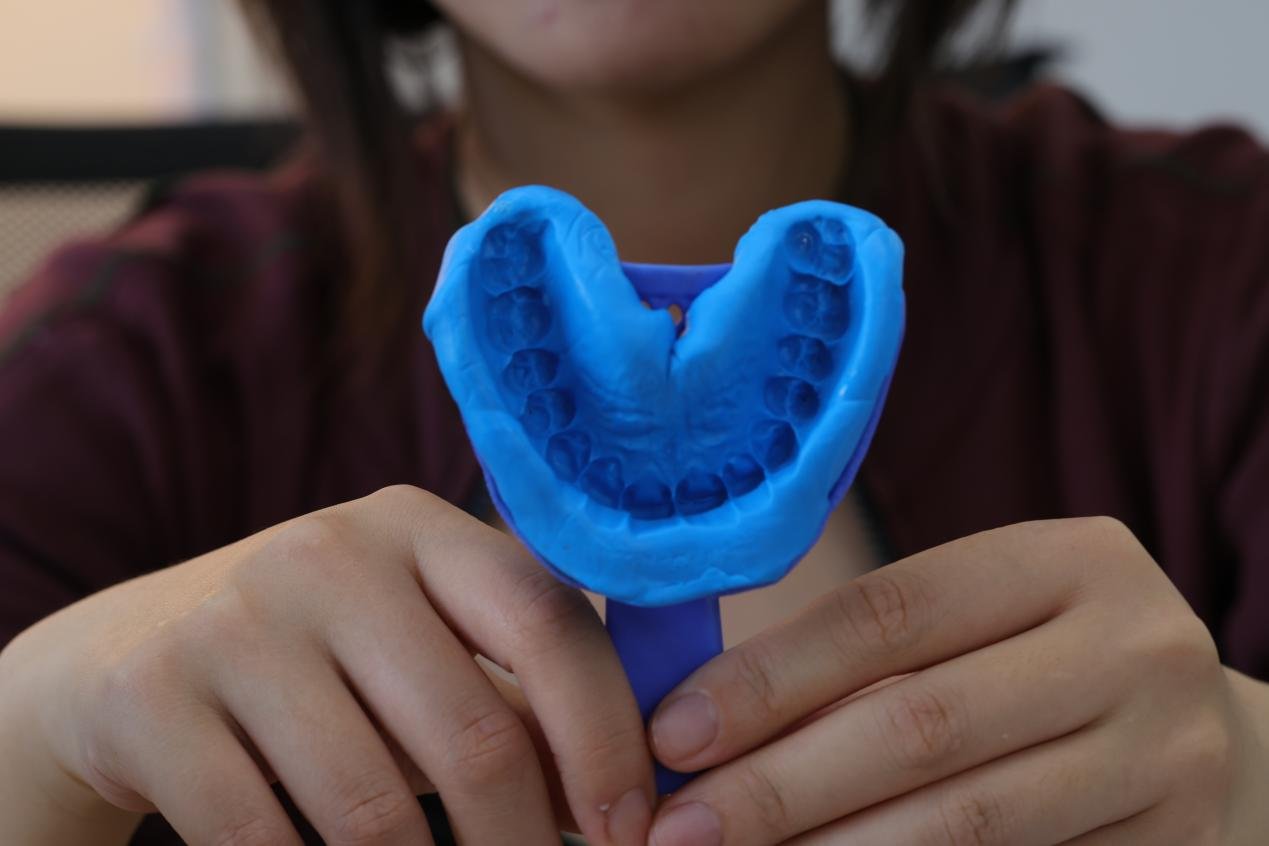 A clear completed dental impression