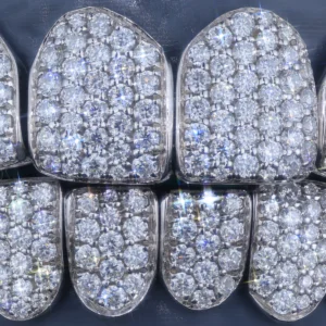 Grillz covered with closely arranged clear stones in a honeycomb-style setting.