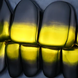 Upper and lower grillz with a glossy black-and-yellow gradient finish.