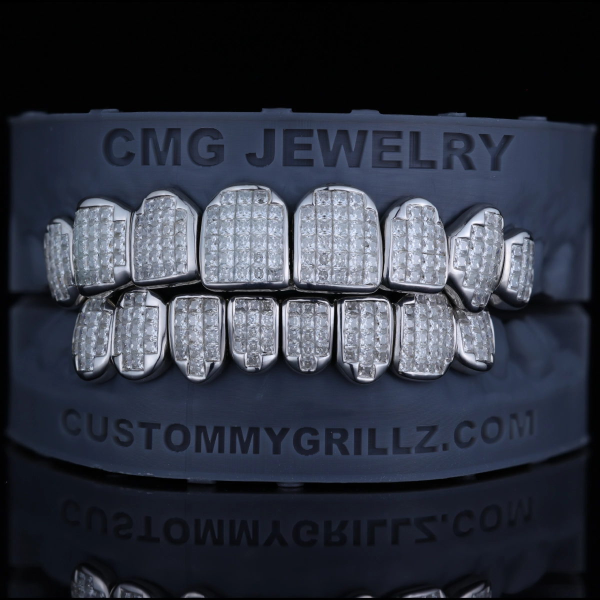 Grillz with closely arranged clear square-cut stones.