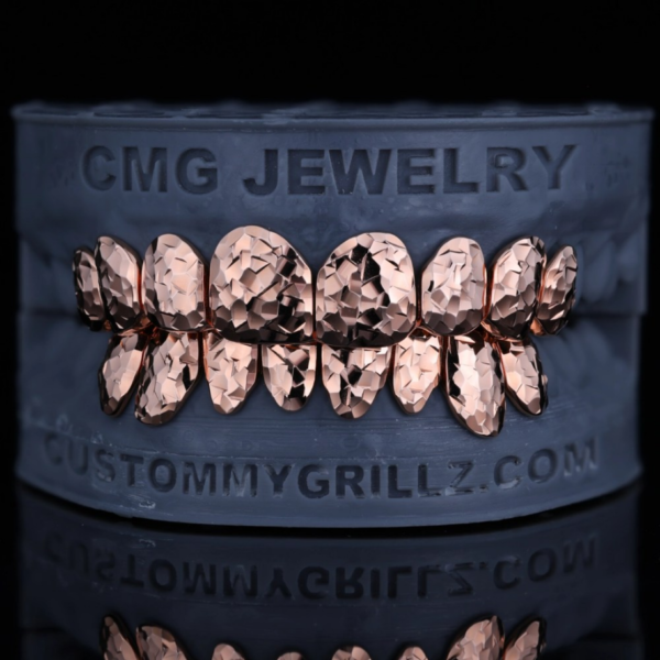 Rose-gold-tone full-set grillz with a crushed-ice textured finish.