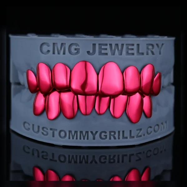 Fuchsia gloss full set custom grillz displayed on a dental model
