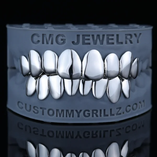 High-polish solid silver full-set grillz displayed on a dental model.